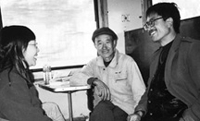 (CREDIT: Beverley Vantomme) Scarboro lay missioner Cynthia Chu (left) chatting with other passengers on the train to Beijing.