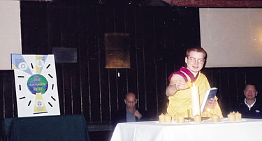 At the Assisi multifaith prayer service for peace at Holy Trinity Anglican Church, Kelsang Chogo, a Buddhist nun, lights a candle following her reading of the Buddhist version of the Golden Rule.