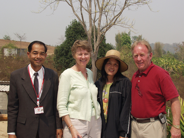 (Credit John Carten, SFM) Anne and Glenn Harty visit with a fellow teacher and his wife at their mushroom farm. They teach at Nuchanat Anusorn high school in the village of Wiang Pa Pao near Chiang Rai, Thailand. There are 1,650 students, 125 of whom board at the school. Anne assists in the English department and Glenn helps the older youth in residence with their studies.