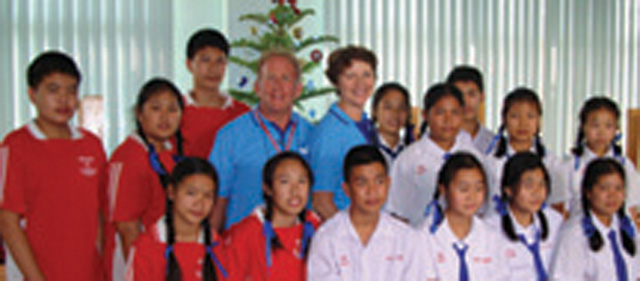 Chawalit the tree climber (in red) and his friend Bunmee, students at Nuchanat Anusorn School, Thailand.