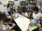 (Credit: Scarboro Missions) The children’s lending library at the Dom Jorge Marskell Association. Top right: Dona Sylvia Aranha de Oliveira, president of the Association, with Fr. Ron MacDonell. Dona Sylvia has worked in the Prelacy of Itacoatiara for the last 40 years as a pastoral agent.