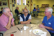 Fr. Charlie Gervais, Bishop Francisco Claver and Fr. Pat Kelly chat in the dining room at Scarboro Missions during Bishop Claver’s visit to address the Assembly at Scarboro’s 12th General Chapter 2007.