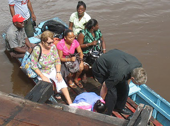 Scarboro missioner Sylvia Wilvert travels by river to visit an isolated community in the interior of Guyana. Sylvia, Kate O’Donnell and Bev Trach make up the Scarboro mission team presently serving in this “land of many waters.”