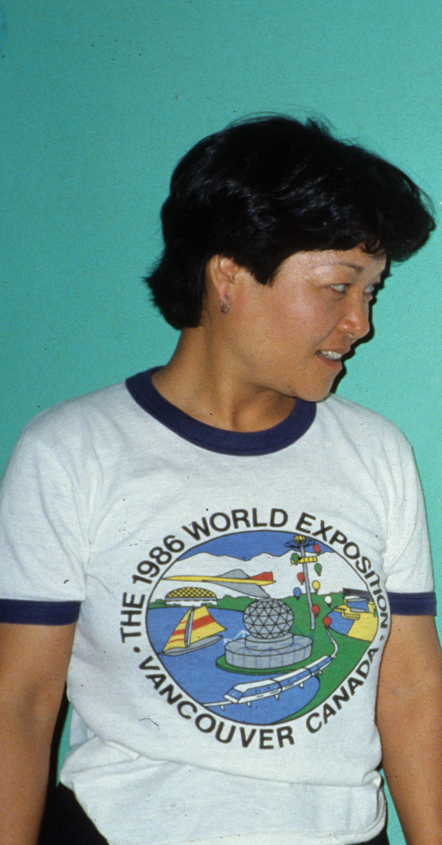 Michiko Ohashi, Japan’s first lay missioner to Peru, stands beside a poster of Fr. Bill Schultz. El Progreso, Peru. First missioned to Japan where he served more than 30 years, Fr. Bill founded a Japanese lay missionary program through which Catholics from Japan could serve in mission.