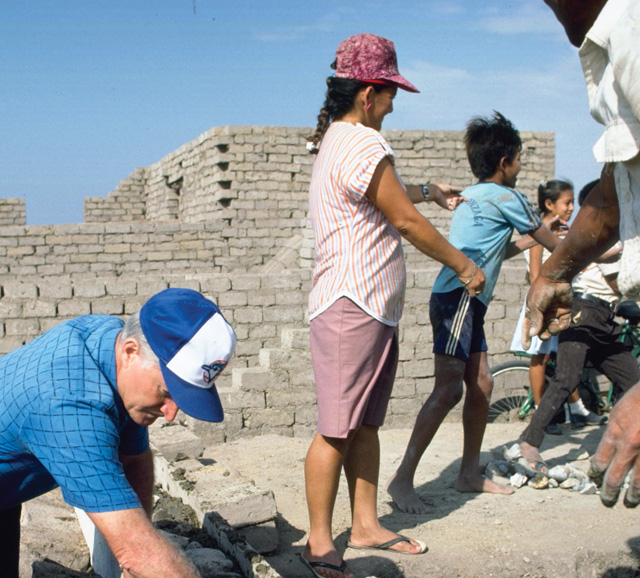 Lay missioner Gerry Heffernan organized a housing project and worked alongside the people to build almost 200 homes.