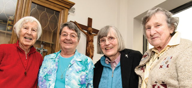 Photo by Michael Swan. Sisters Mary Hughes, Joan Missiaen, Susan Moran, and Cecile Turner at the opening ceremony.