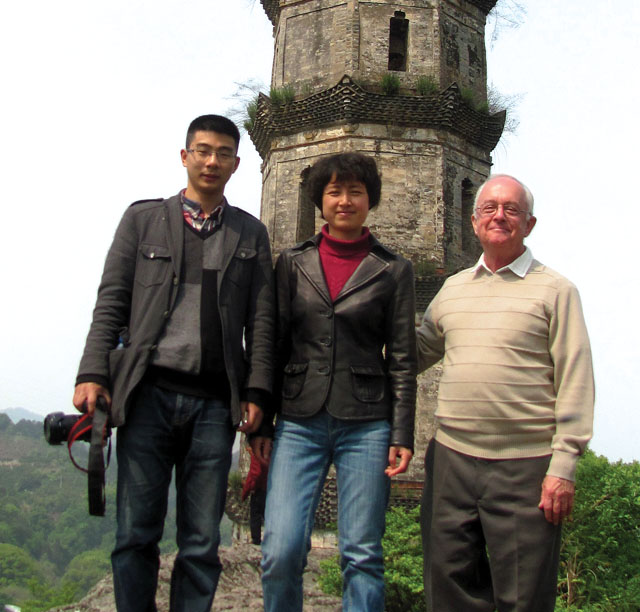 L-R: Historian Zhou Lu, English professor Renying and Fr. Mike Traher at the Lishui pagoda, the same pagoda as shown on the facing page. In the 1930s the first wave of Scarboro missionaries arrived in the city of Lishui (formerly Chuchow prefecture) in the province of Chekiang (Zhejiang), China. Fr. Mike writes, “Perhaps a thousand years old, this ancient landmark is perched on top of a large hill overlooking the Lishui River where the river divides into two branches. When returning from their mission stations, the early Scarboro missionaries looked for the familiar pagoda to know that they were almost home.”