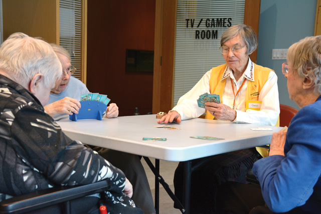 (Credit: Patti Enright) A game of Euchre at Cardinal Ambrozic Houses of Providence. L-R: Frances Hodgson, Mary McConville, Sister Gwen Legault, Noella Cadeau. Toronto.